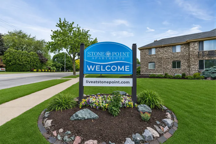 Welcome sign at Stone Point Apartments in Menomonee Falls, WI
