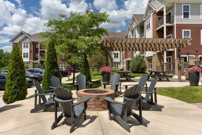 Outdoor picnic area at Elan Apartments in Fitchburg, Wisconsin offering shared seating and green space for residents.