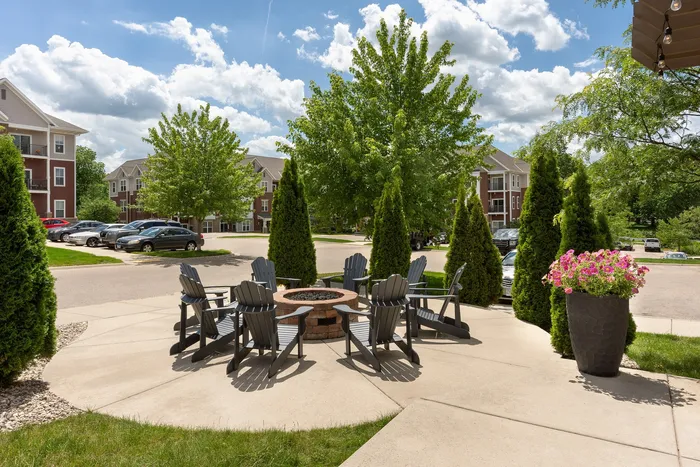 Outdoor picnic area at Elan Apartments in Fitchburg, Wisconsin offering shared seating and green space for residents.