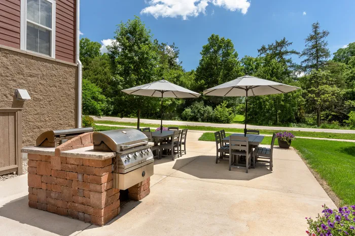 Outdoor picnic area at Elan Apartments in Fitchburg, Wisconsin offering shared seating and green space for residents.
