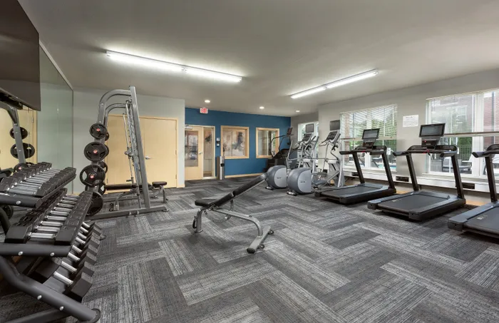 24-hour fitness center at Elan Apartments in Fitchburg, Wisconsin equipped for strength and cardio workouts.