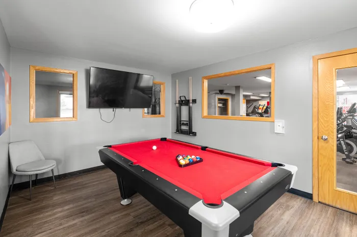 Resident clubhouse at Valley View Apartments featuring shared community entertainment area.