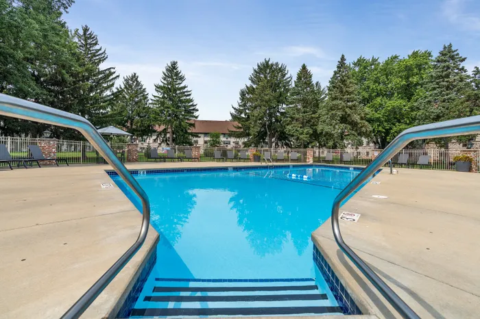 Heated outdoor pool with sundeck at Valley View Apartments for seasonal relaxation.