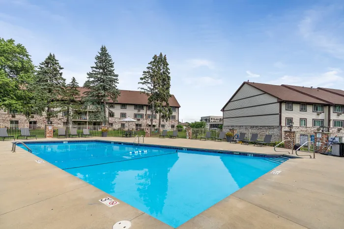 Heated outdoor pool with sundeck at Valley View Apartments for seasonal relaxation.