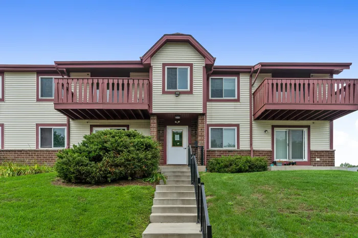 Apartment building exterior and landscaped grounds at Ridge View Apartments.