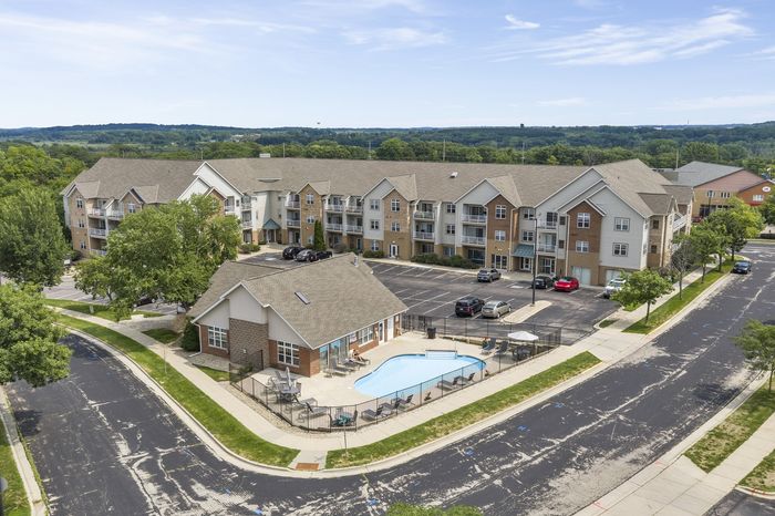 Apartment building and landscaped grounds at The Landmark at Hatchery Hill.