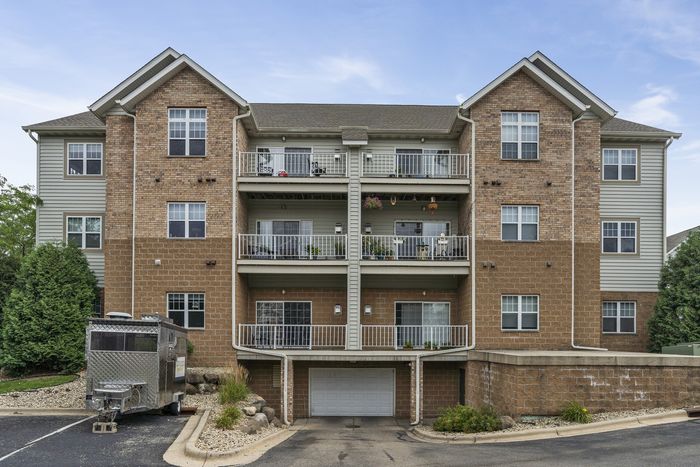 Apartment building exterior at The Landmark at Hatchery Hill community.