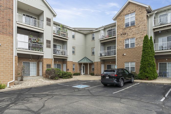 Multi-story residential exterior at The Landmark at Hatchery Hill.