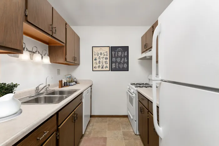 Fully equipped kitchen at Stone Point Apartments featuring updated finishes and functional layout.