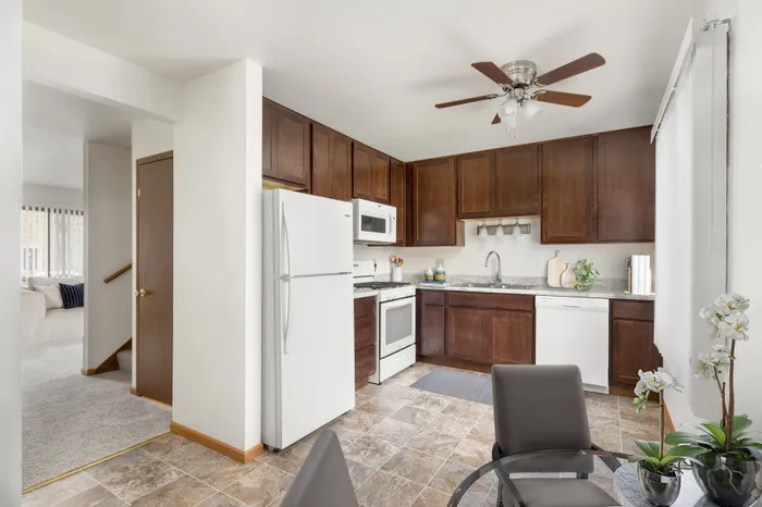 Fully equipped kitchen at Stone Point Apartments featuring updated finishes and functional layout.