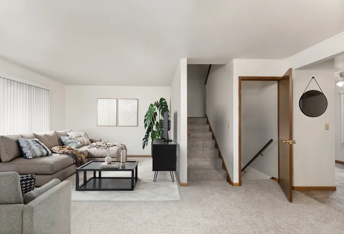 Alternate living room view at Stone Point Apartments with open design.
