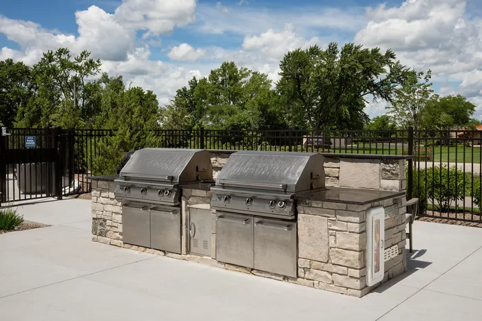 Outdoor grilling station at Seasons at Elgin Apartments.