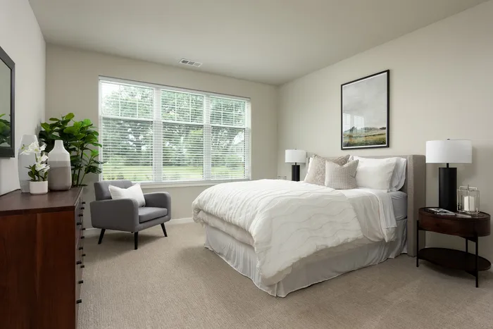 Bedroom at Seasons at North Aurora Apartments.