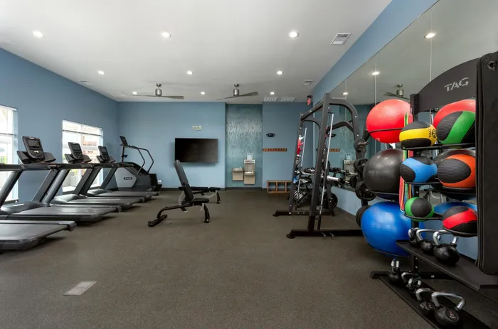 Fitness center at Seasons at North Aurora Apartments.