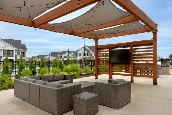 Outdoor lounge area at Seasons at North Aurora Apartments.