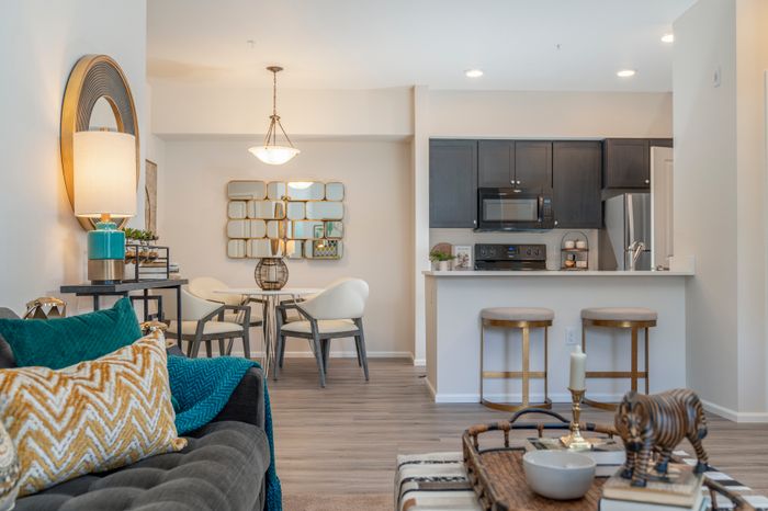 Model Living Room + Dining Room + Kitchen l Luxury Apartments for Rent in Tacoma, WA l 1500 Orchard