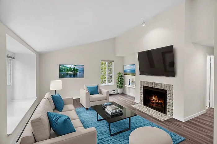 Inviting living room with plush seating, fireplace, and modern decor.