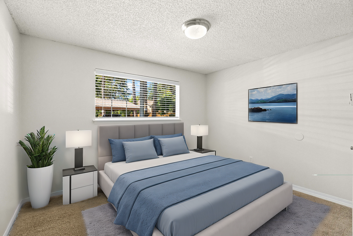 Bright and modern bedroom with a comfortable bed, stylish decor, and a large window overlooking a scenic view.