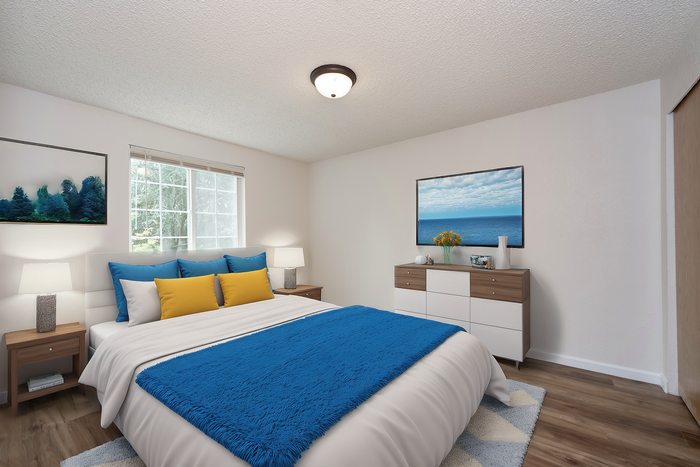 Bright, stylish bedroom with a large window, blue and yellow accents, and modern decor.