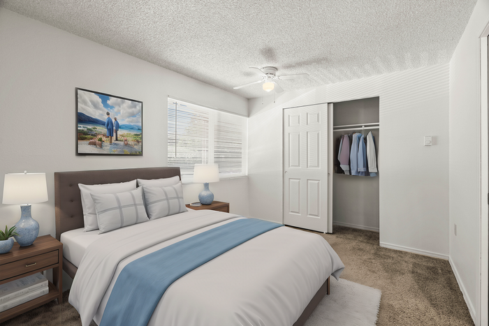 Inviting bedroom with a comfortable bed, modern decor, and ample natural light from large windows.