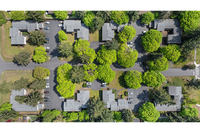 Drone footage providing an aerial view of the apartment community and the surrounding greenery.