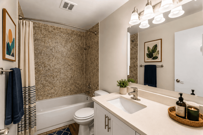 Modern bathroom featuring elegant fixtures, a luxurious bathtub, and stylish decor, creating a serene oasis.
