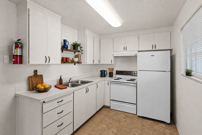 Bright and airy kitchen with modern white cabinets, sleek countertops, and a cozy ambiance perfect for culinary creativity.