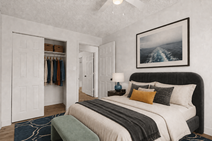 Elegant and cozy bedroom with stylish decor, featuring a plush bed, modern artwork, and spacious closet.