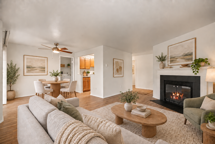 Inviting living space featuring a cozy fireplace, modern furniture, and elegant decor, perfect for relaxing and entertaining.