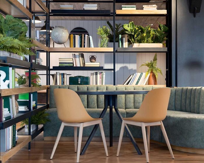 Chic reading nook with modern shelving, lush green plants, stylish seating, and elegant parquet flooring.