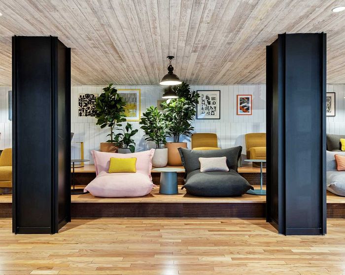 Chic lounge area with plush seating, vibrant cushions, and modern decor, perfect for relaxation and social gatherings.