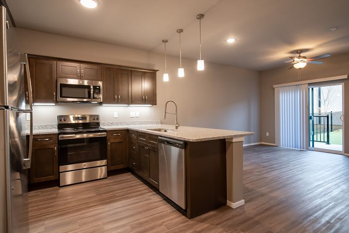Promenade-Commons-Apartments-Rogers-Arkansas-Phase-Two-One-Bedroom-With-Backyard-Kitchen-Living-Room