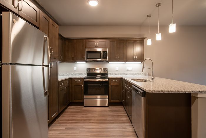 Promenade-Commons-Apartments-Rogers-Arkansas-Phase-Two-One-Bedroom-With-Backyard-Kitchen