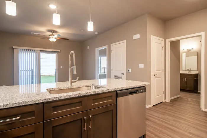 Promenade-Commons-Apartments-Rogers-Arkansas-Phase-Two-One-Bedroom-With-Backyard-Living-Room-Kitchen-View