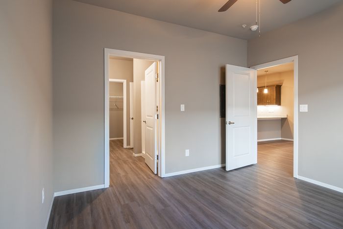 Promenade-Commons-Apartments-Rogers-Arkansas-Phase-Two-One-Bedroom-With-Backyard-Primary-Bedroom-Entrance