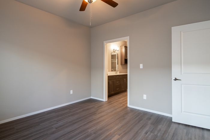 Promenade-Commons-Apartments-Rogers-Arkansas-Phase-Two-One-Bedroom-With-Backyard-Primary-Bedroom