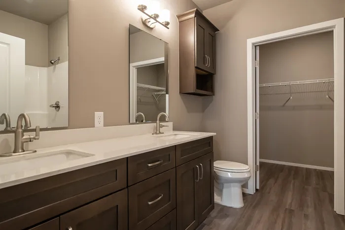 Promenade-Commons-Apartments-Rogers-Arkansas-Phase-Two-One-Bedroom-With-Backyard-Primary-Bathroom-Sink-Closet