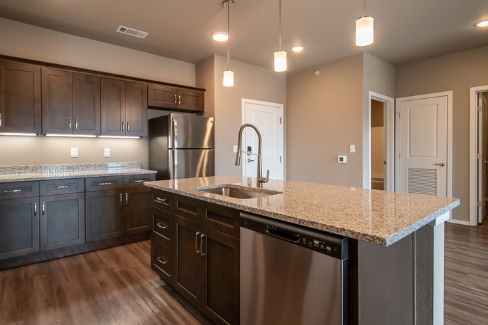 Promenade-Commons-Apartments-Rogers-Arkansas-Phase-Two-Two-Bedroom-E-Kitchen-Island-Granite-Countertops