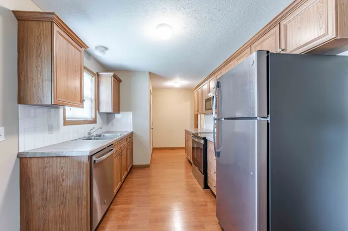 Oakwood-Heights-Townhomes-Republic-Missouri-Phase-1-Three-Bedroom-Remodeled-Kitchen-Hallway-View