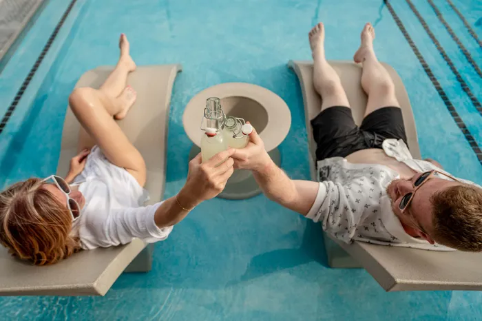 Heritage-Apartments-Springfield-Missouri-Luxury-Amenities-Pool-Lounge-Chairs