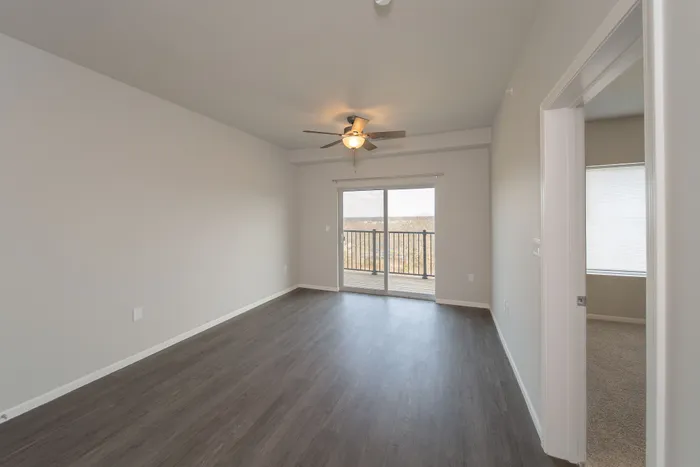 Crescent-Falls-Apartments-Joplin-Missouri-One-Bedroom-Living-Room-Balcony-Doors