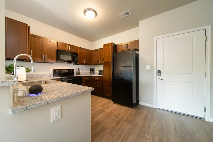 Crescent-Falls-Apartments-Joplin-Missouri-Furnished-One-Bedroom-Kitchen-And-Front-Door