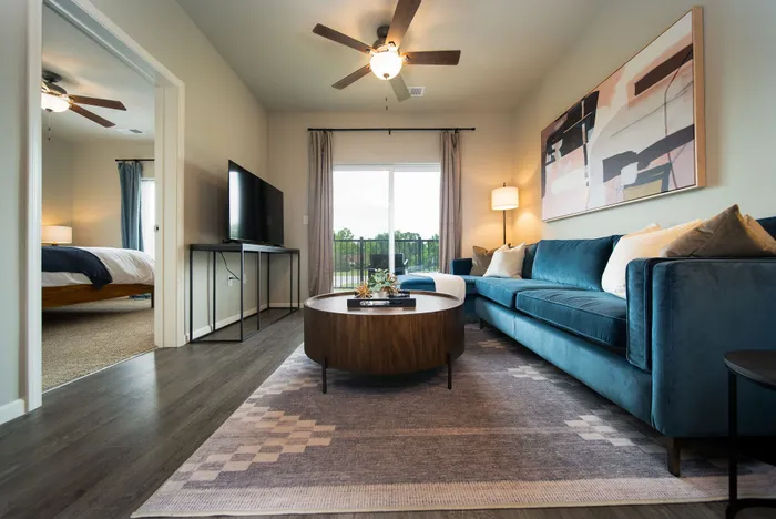 Crescent-Falls-Apartments-Joplin-Missouri-Furnished-One-Bedroom-Living-Room-Balcony-Doors