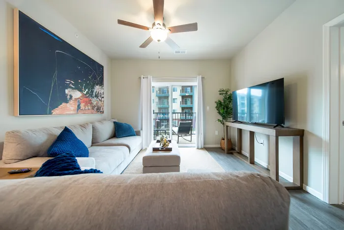 Crescent-Falls-Apartments-Joplin-Missouri-Furnished-Two-Bedroom-Living-Room-Balcony-Doors