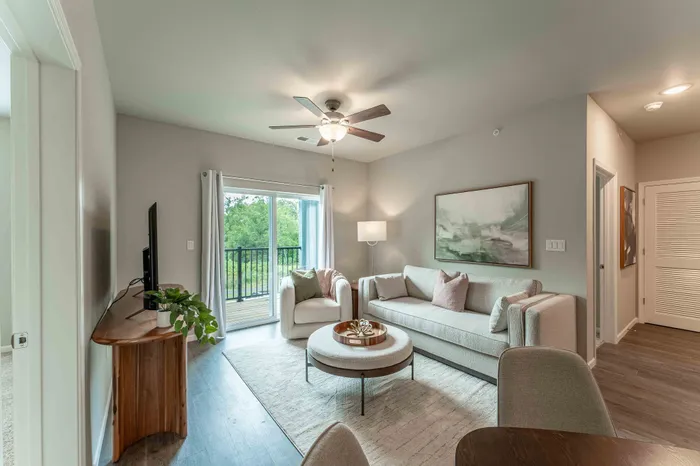 Crescent-Falls-Apartments-Joplin-Missouri-Furnished-Two-Bedroom-AirBNB-Living-Room-Balcony-Doors