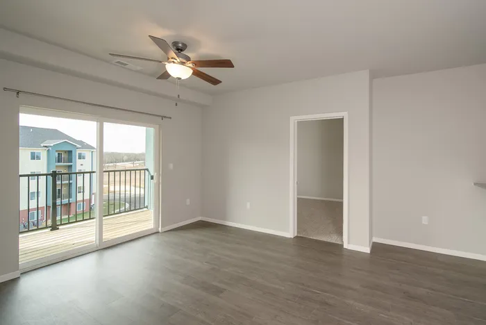Crescent-Falls-Apartments-Joplin-Missouri-Two-Bedroom-Living-Room-Balcony-Doors