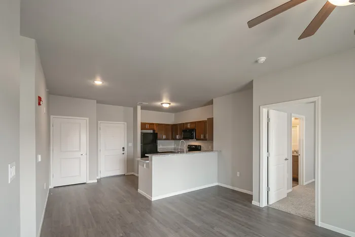 Crescent-Falls-Apartments-Joplin-Missouri-Three-Bedroom-Living-Room-Kitchen