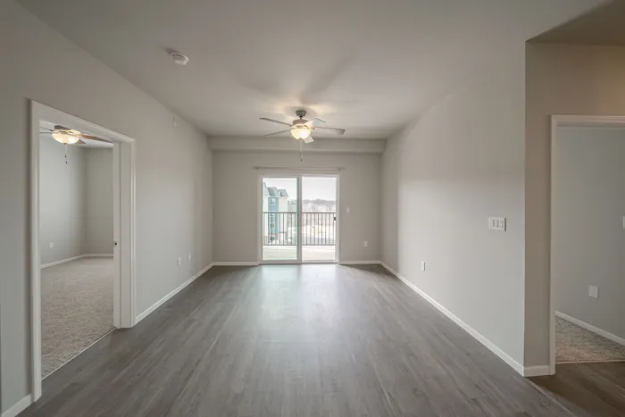 Crescent-Falls-Apartments-Joplin-Missouri-Three-Bedroom-Living-Room-Balcony-Doors