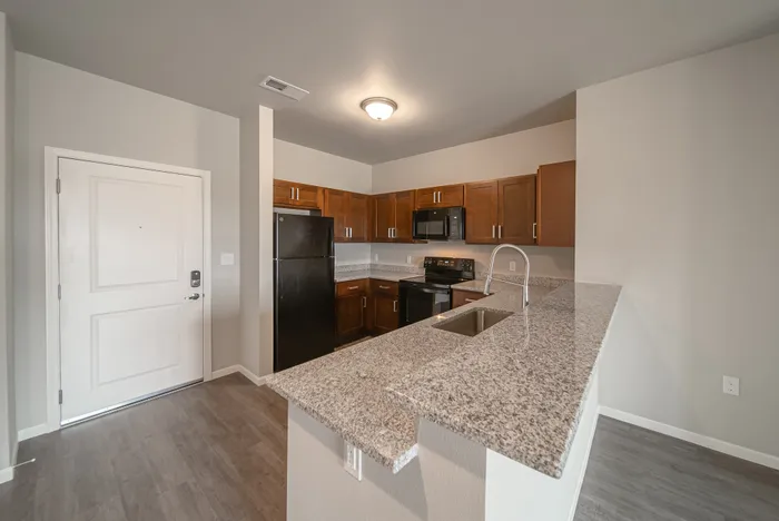 Crescent-Falls-Apartments-Joplin-Missouri-Three-Bedroom-Kitchen-Front-Door