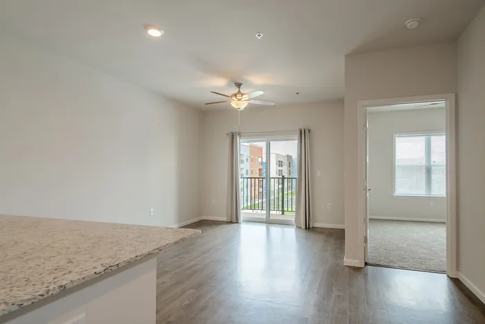 Union-Mill-Apartments-Wichita-Kansas-One-Bedroom-Living-Room-Balcony-Doors